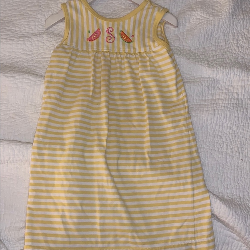 Yellow striped dress with S monogram